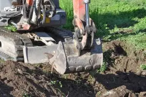 Using a Mini Excavator Rental to Build a Retaining Wall