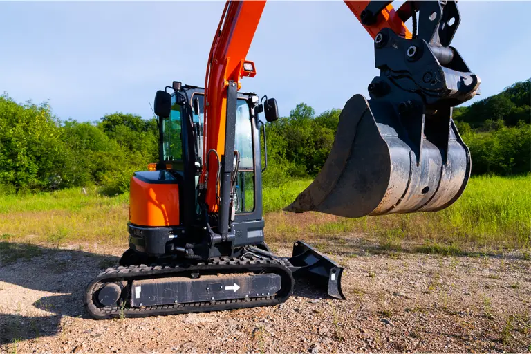 mini excavator on dirt